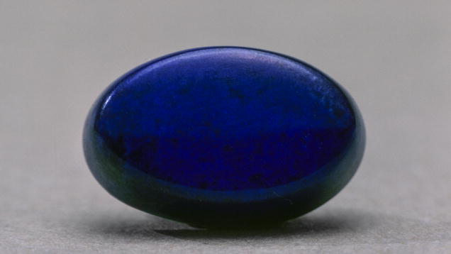 Lapis Lazuli. The even, deep blue color of this lapis lazuli cabochon is rare and highly prized by connoisseurs.
