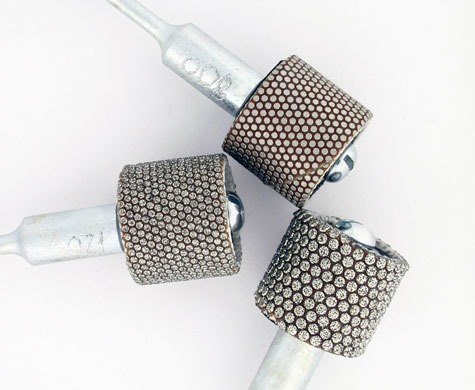 Three 3M Flexible Diamond abrasive bands; numbers are visible on the shaft Three 3M Flexible Diamond abrasive bands; numbers are visible on the shaft