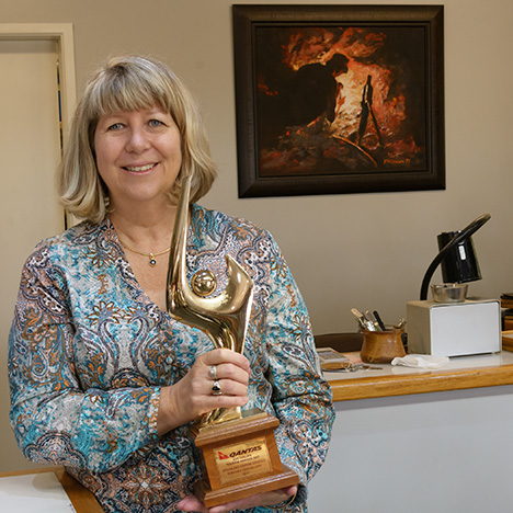 Woman holding trophy Woman holding trophy
