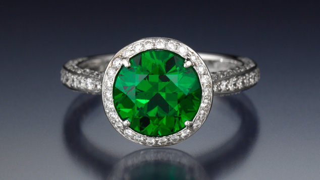 3.20 Carat Demantoid Garnet. This 3.20-carat demantoid garnet’s vivid green hue is exceptionally beautiful. In fact, it’s close to the top color for this variety. The gem is mounted in a platinum ring with diamond accents. - Courtesy A Touch of Color