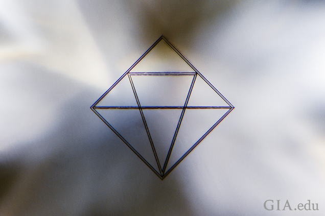 De Beers’ line of CVD laboratory-grown diamonds can be easily recognized by the 300 × 300 micron logo inscribed about 200 microns below the surface of the table facet. De Beers’ line of CVD laboratory-grown diamonds can be easily recognized by the 300 × 300 micron logo inscribed about 200 microns below the surface of the table facet.