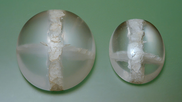 Quartz cabochons with cross-shaped quartz inclusions. Quartz cabochons with cross-shaped quartz inclusions.