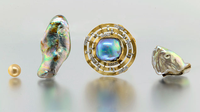 F15-LN-Figure-20_191026-636x358.jpg. Three abalone pearls alongside South Sea bead-cultured pearl.