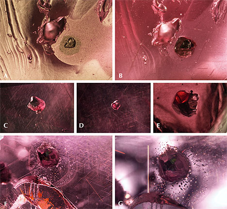 Surface-reaching sulfide crystal in “color-change” pyrope garnet Surface-reaching sulfide crystal in “color-change” pyrope garnet