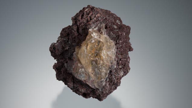 This large yellow feldspar phenocryst is embedded in a matrix of volcanic cinder. - Robert Weldon This large yellow feldspar phenocryst is embedded in a matrix of volcanic cinder. - Robert Weldon