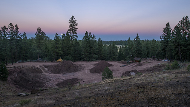 The red rocks of the Ponderosa mine’s pit complement the setting sun. - Robert Weldon The red rocks of the Ponderosa mine’s pit complement the setting sun. - Robert Weldon