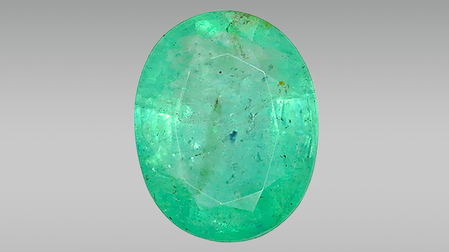 FA16-LN-Figure-10_207954-636x358.jpg. 7.11 ct emerald with a large purple inclusion