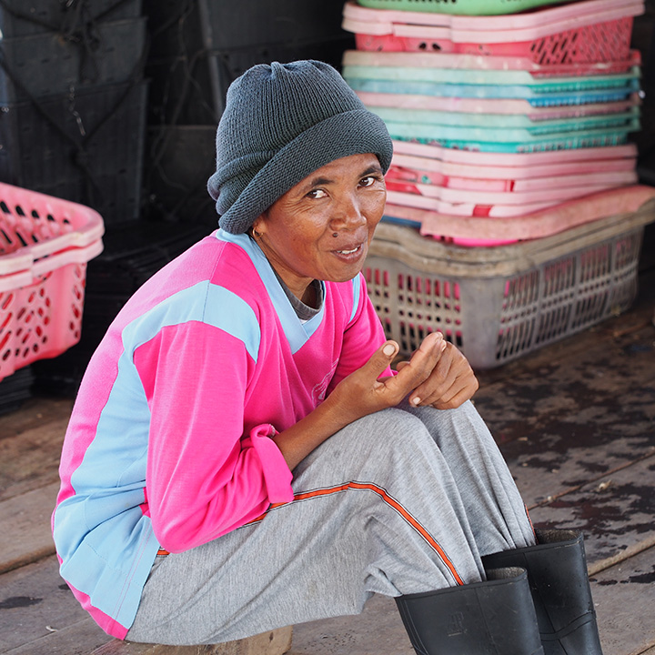 FA16-Sturman-Gallery-4_208492-720x720.jpg. One of the more colorful employees encountered on the Lombok farm visit. Pearl farms provide employment to local residents in remote areas who might have no other means of income. Photo by Julie Poli.