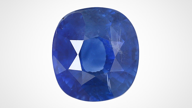 Heated blue sapphire with unusual inclusions.