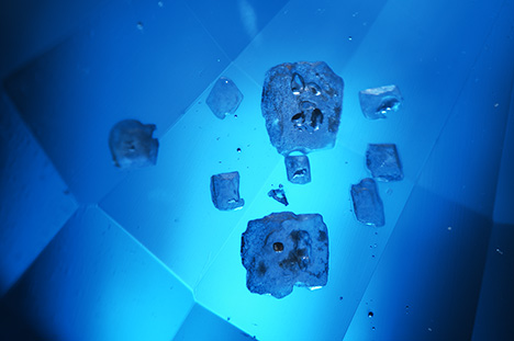 Glass-filled cavities on the sapphire’s pavilion. Glass-filled cavities on the sapphire’s pavilion.