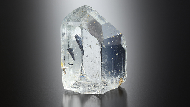 Ferrocolumbite inclusions in a topaz crystal. Ferrocolumbite inclusions in a topaz crystal.