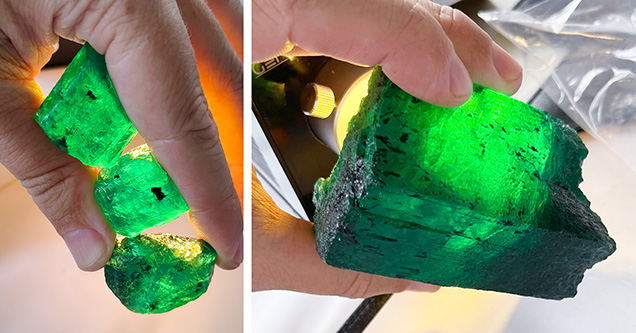 Figure 2. Large emerald crystals from the Kagem mine in Zambia. The three crystals have a combined weight of 106 g, while the large single crystal weighs 479 g. In these stones, visible fractures and inclusions will determine how the pieces are processed into smaller preforms before going to polishing. Photos by Wim Vertriest.