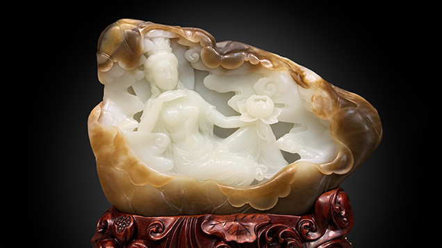 Figure 17. A Russian white nephrite carving depicting a woman holding a lotus flower, measuring approximately 30 × 19 × 5 cm. Photo by Yu Ming. Figure 17. A Russian white nephrite carving depicting a woman holding a lotus flower, measuring approximately 30 × 19 × 5 cm. Photo by Yu Ming.
