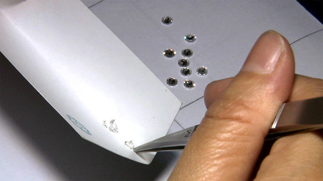 Color grading is done under daylight-equivalent fluorescent light, with white folded cards and masterstones.