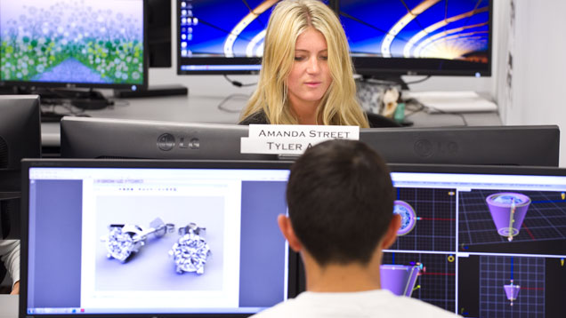 Students work on dual monitors in JDT class Students work on dual monitors in JDT class