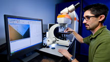 A gemstone sample is correctly oriented so that Raman spectrum data can be collected.