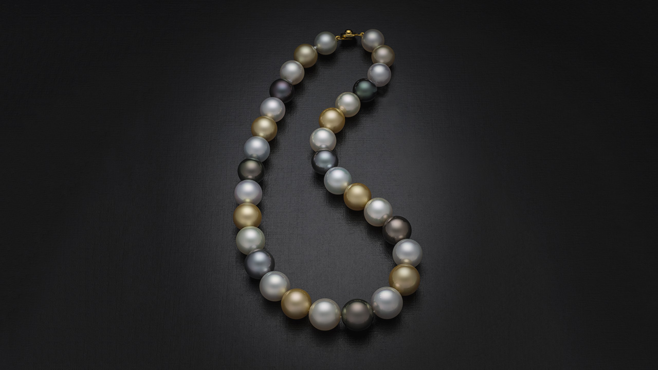 This very fine 12–14 mm multicolor necklace was assembled piece by piece using Australian, Philippine, and Tahitian cultured pearls. Each cultured pearl is matched for size and shape, and all have exceptional luster. Photo by Robert Weldon.