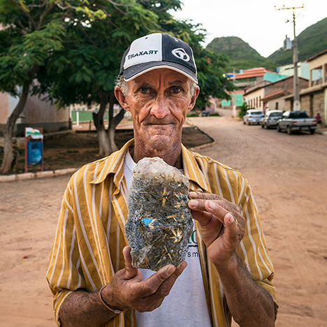 Miner with rutilated quartz. Miner with rutilated quartz.