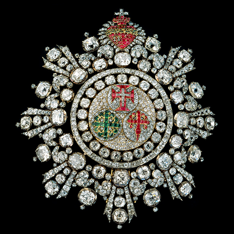 Badge from Portuguese crown jewels with Brazilian diamonds. Figure 1. The Portuguese Placa dos Três Militares, or Badge of the Three Military Orders, was made in 1789, and is now part of the crown jewelry collection of the Ajuda National Palace in Lisbon. The badge consists of Brazilian diamonds as well as emeralds and rubies, and it is designed in a way to conceal the metal mounting and emphasize the gems. Photo by Manuel Silveira Ramos, courtesy of the Ajuda National Palace.