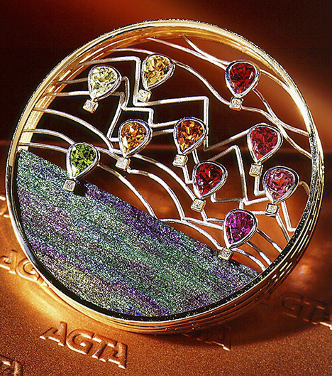 Flying Free brooch with garnets and Brazilian rainbow hematite. Flying Free brooch with garnets and Brazilian rainbow hematite.