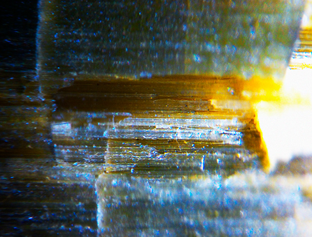 Parallel striations and tube-like inclusions. Parallel striations and tube-like inclusions.