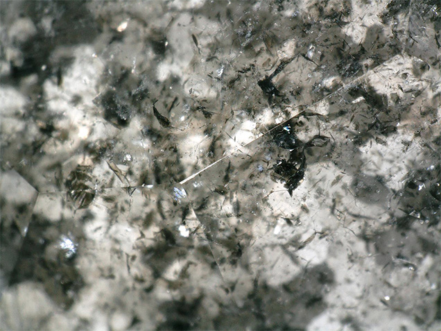 Needle clusters in the carved diamond ring.