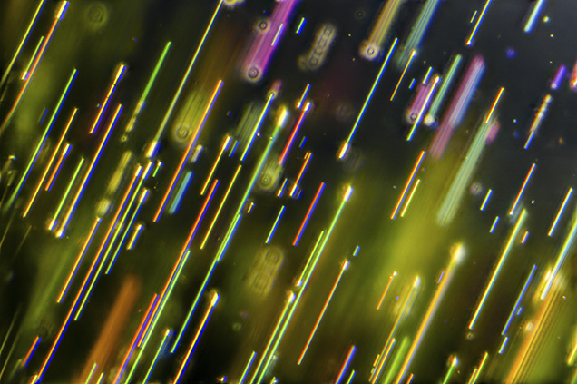 Colorful needle-like inclusions in pallasitic peridot. Colorful needle-like inclusions in pallasitic peridot.