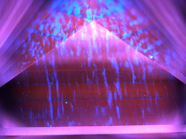 Typical orange-red fluorescence with irregular blue “banding” Typical orange-red fluorescence with irregular blue “banding”
