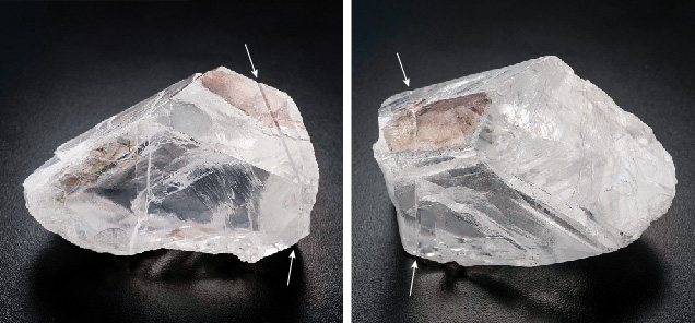Figure 4. Two views of a large rough diamond with a pronounced mechanical twin plane. This 812 ct diamond, named the Constellation, has both freshly cleaved surfaces (left) and natural resorbed surfaces (right). Both views show a kink that wraps around the entire surface and defines an internal {111} twin plane where the crystal orientation is reversed with respect to the rest of the diamond. The diamond is 6.6 cm in its longest dimension. Photos by Jian Xin (Jae) Liao. Figure 4. Two views of a large rough diamond with a pronounced mechanical twin plane. This 812 ct diamond, named the Constellation, has both freshly cleaved surfaces (left) and natural resorbed surfaces (right). Both views show a kink that wraps around the entire surface and defines an internal {111} twin plane where the crystal orientation is reversed with respect to the rest of the diamond. The diamond is 6.6 cm in its longest dimension. Photos by Jian Xin (Jae) Liao.