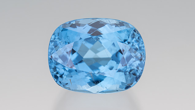 Figure 3. A 30.26 ct blue cushion-cut cuprian tourmaline from Mozambique. Photo by Robert Weldon; courtesy of Evan Caplan. Figure 3. A 30.26 ct blue cushion-cut cuprian tourmaline from Mozambique. Photo by Robert Weldon; courtesy of Evan Caplan.