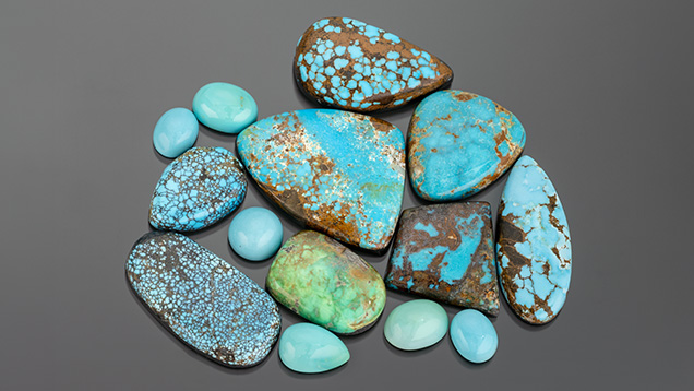 alt="A collection of various turquoise stones in different shapes and sizes, featuring vibrant blue and green hues with brown matrix patterns." alt="A collection of various turquoise stones in different shapes and sizes, featuring vibrant blue and green hues with brown matrix patterns."