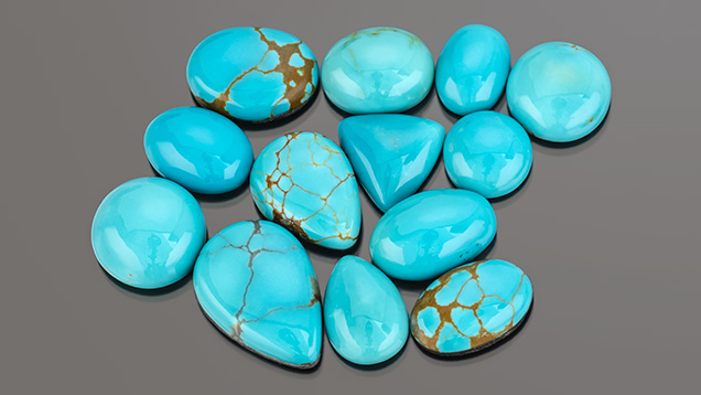 Figure 3. Stabilized Nevada turquoise from the Supernova mine. Sizes range from 5.61 to 13.09 ct. Photo by Robert Weldon; courtesy of Out of Our Mines. Figure 3. Stabilized Nevada turquoise from the Supernova mine. Sizes range from 5.61 to 13.09 ct. Photo by Robert Weldon; courtesy of Out of Our Mines.