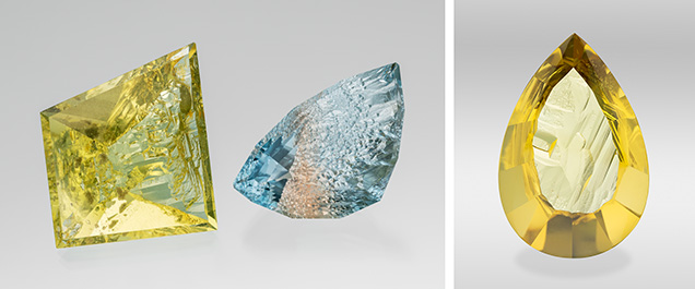 Figure 1. Left: This 109.68 ct heliodor and 80.62 ct bicolor topaz are from the Volyn deposit in Ukraine. They are cut to leave natural etch faces on the pavilion/culet, while the crown and table are faceted. Right: A 162.22 ct pear-cut heliodor. The natural etching patterns are retained on the pavilion and are well displayed through the polished table. Photos by Robert Weldon; courtesy of Nomad’s. Figure 1. Left: This 109.68 ct heliodor and 80.62 ct bicolor topaz are from the Volyn deposit in Ukraine. They are cut to leave natural etch faces on the pavilion/culet, while the crown and table are faceted. Right: A 162.22 ct pear-cut heliodor. The natural etching patterns are retained on the pavilion and are well displayed through the polished table. Photos by Robert Weldon; courtesy of Nomad’s.