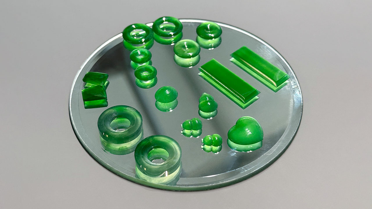 Figure 2. Several Guatemalan jade pieces placed on a mirror to demonstrate the transparency of the material. Photo by Jennifer Stone-Sundberg; courtesy of Pillar & Stone. Figure 2. Several Guatemalan jade pieces placed on a mirror to demonstrate the transparency of the material. Photo by Jennifer Stone-Sundberg; courtesy of Pillar & Stone.