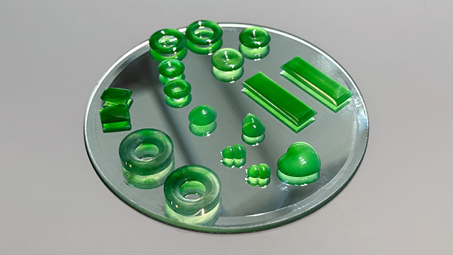 Figure 2. Several Guatemalan jade pieces placed on a mirror to demonstrate the transparency of the material. Photo by Jennifer Stone-Sundberg; courtesy of Pillar & Stone. Figure 2. Several Guatemalan jade pieces placed on a mirror to demonstrate the transparency of the material. Photo by Jennifer Stone-Sundberg; courtesy of Pillar & Stone.