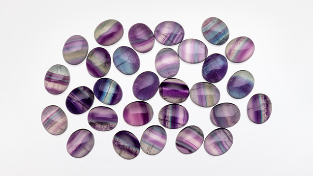 Figure 4. Rainbow fluorite cabochons measuring 10 × 12 mm. Photo by Kevin Schumacher; courtesy of Jennifer Stone-Sundberg. Figure 4. Rainbow fluorite cabochons measuring 10 × 12 mm. Photo by Kevin Schumacher; courtesy of Jennifer Stone-Sundberg.
