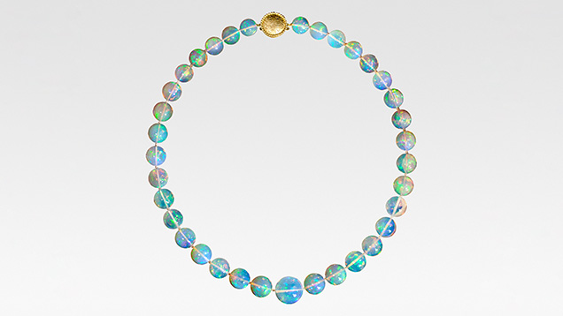 Figure 6. This 22-inch “Ethereal Light” necklace contains 35 translucent Ethiopian opal beads totaling 426 carats and is finished with an 18K gold handmade clasp. Courtesy of Paula Crevoshay. Figure 6. This 22-inch “Ethereal Light” necklace contains 35 translucent Ethiopian opal beads totaling 426 carats and is finished with an 18K gold handmade clasp. Courtesy of Paula Crevoshay.