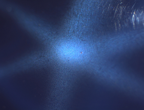 SU15-GNI-fig16_185350-468x356.jpg. Needle-like inclusions causing asterism in synthetic sapphire.