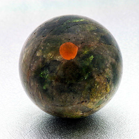 Polished sphere with calcite inclusion Polished sphere with calcite inclusion