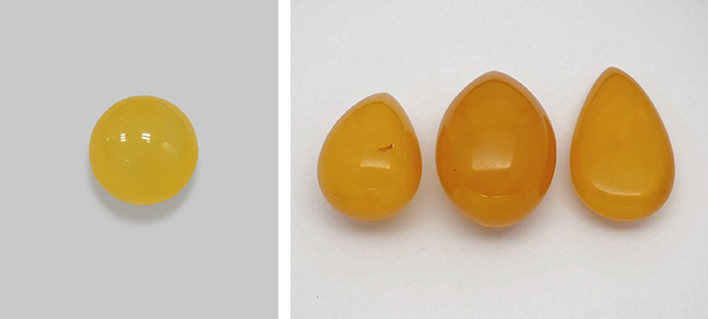 Steam-dyed “chicken-fat yellow beeswax” amber.