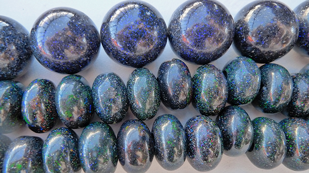 Opal beads with blue play-of-color. Opal beads with blue play-of-color.