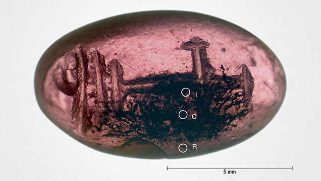 Early Byzantine garnet intaglio with inclusion-rich core and a more transparent rim Early Byzantine garnet intaglio with inclusion-rich core and a more transparent rim