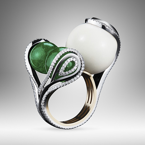 One-of-a-kind ring featuring two emerald beads and one tagua seed bead.
