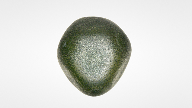 Rough diamond with patchy green surface color. Rough diamond with patchy green surface color.