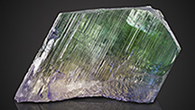 Large rough spodumene crystal exhibiting pleochroism. Large rough spodumene crystal exhibiting pleochroism.