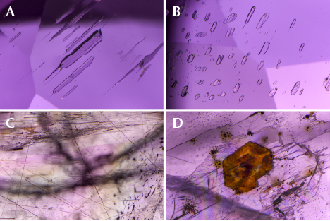 Fluid inclusions, rutile needles, and a crystal in purplish pink diaspore. Fluid inclusions, rutile needles, and a crystal in purplish pink diaspore.
