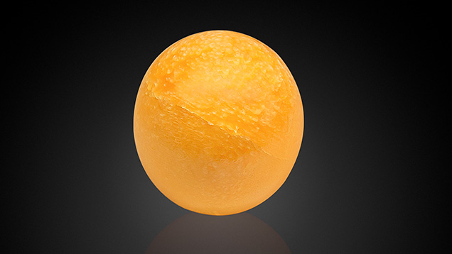 Melo pearl with a fine visible crack. Melo pearl with a fine visible crack.