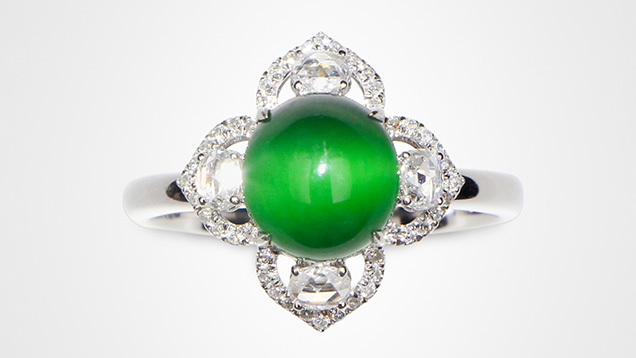 Green omphacite fei cui jade displaying chatoyancy. Green omphacite fei cui jade displaying chatoyancy.