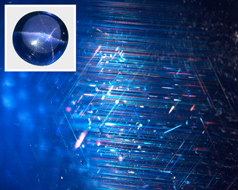 Six-rayed asterism produced by intersecting sets of parallel needle inclusions.