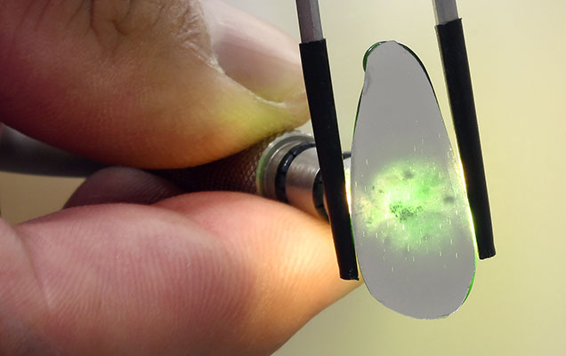 Figure 2. The see-through nature of the carving and thin reflective film backing. Photo by Diego Sanchez.